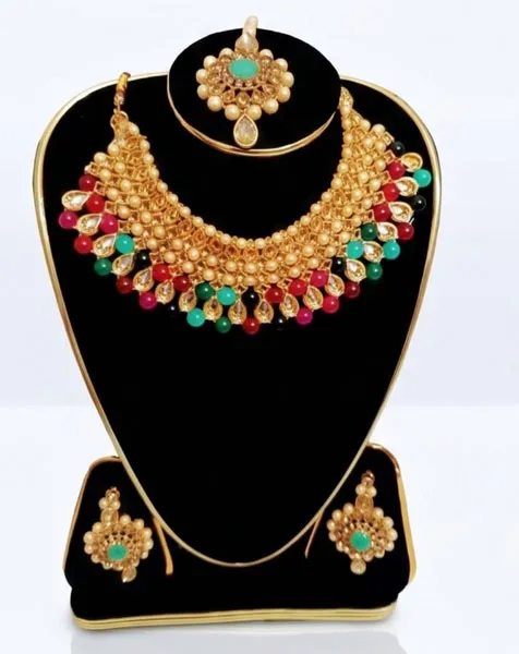 Royal Kundan-Style Multicolored Choker Jewelry Set includes a statement choker matching drop earrings, and a coordinated maang tikka.