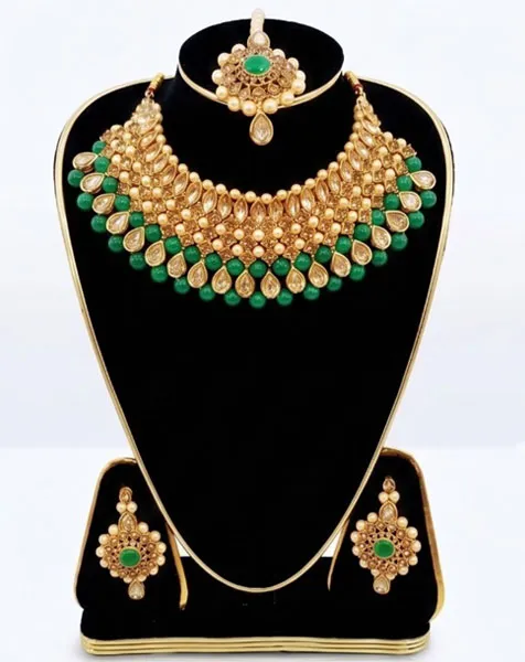 Emerald Elegance Kundan Choker Set includes a statement choker matching drop earrings, and a coordinated maang tikka. thumbnail