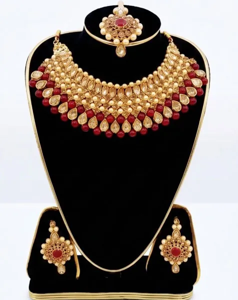 Regal Crimson & Gold Kundan Jewelry Set includes a statement choker matching drop earrings, and a coordinated maang tikka. thumbnail